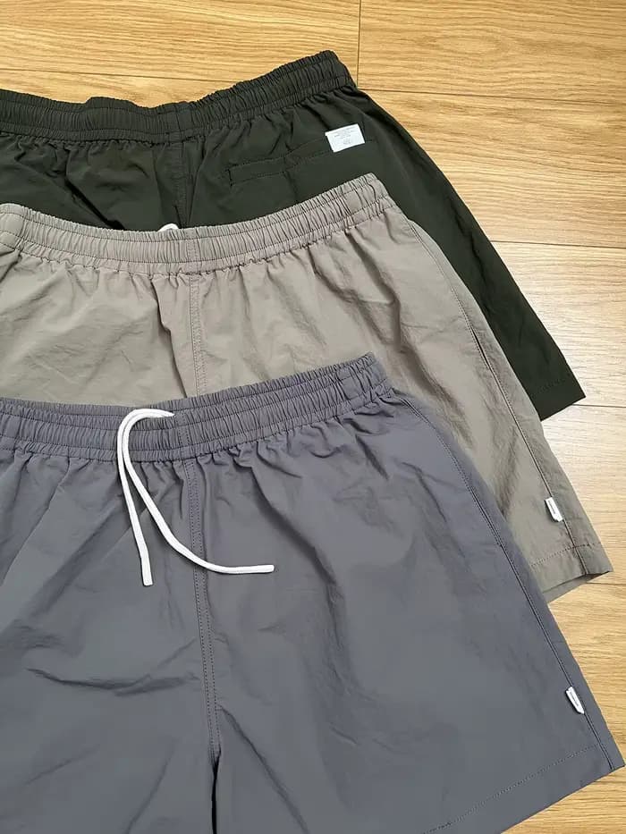 MADNESS NYLON SHORTS Short de plage ample décontracté à quatre points de style américain à séchage rapide