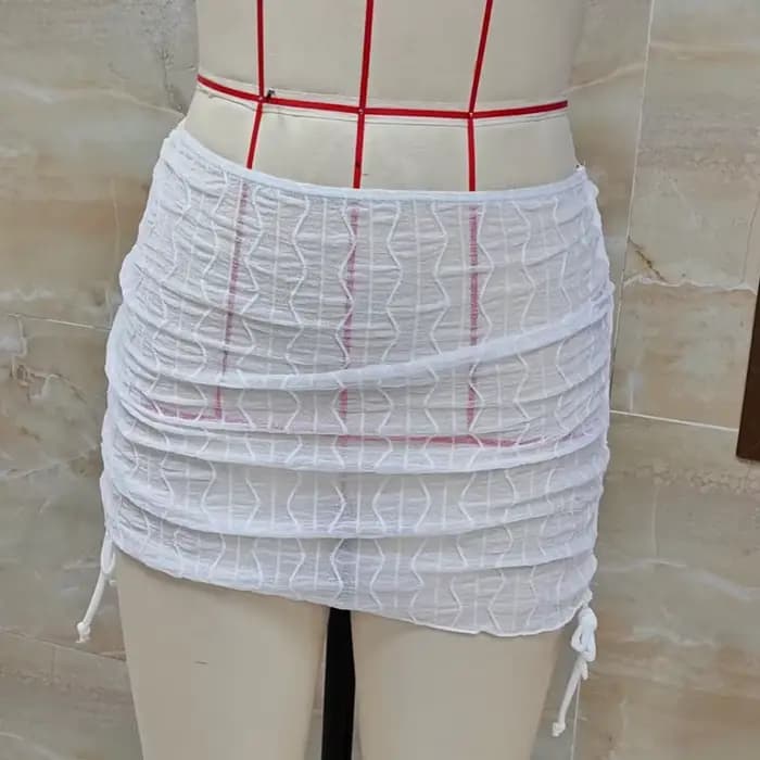 Mini-jupe de plage en maille transparente pour femme
