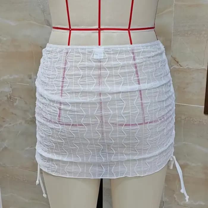 Mini-jupe de plage en maille transparente pour femme
