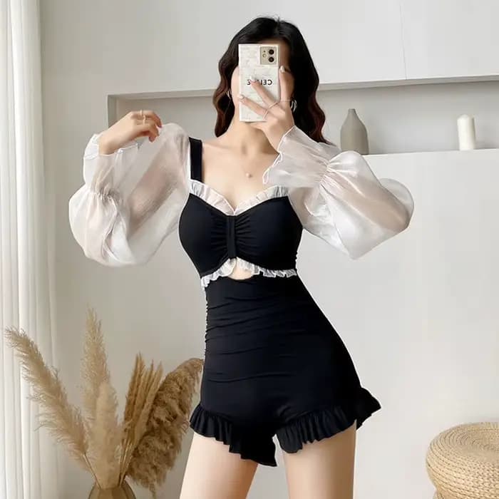 Maillot de bain une pièce élégant noir transparent à manches longues avec découpe avant et volants