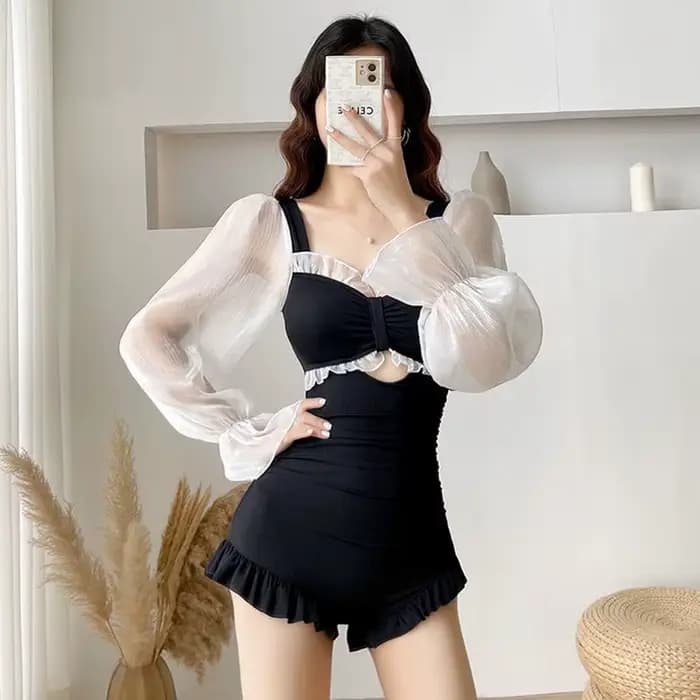 Maillot de bain une pièce élégant noir transparent à manches longues avec découpe avant et volants