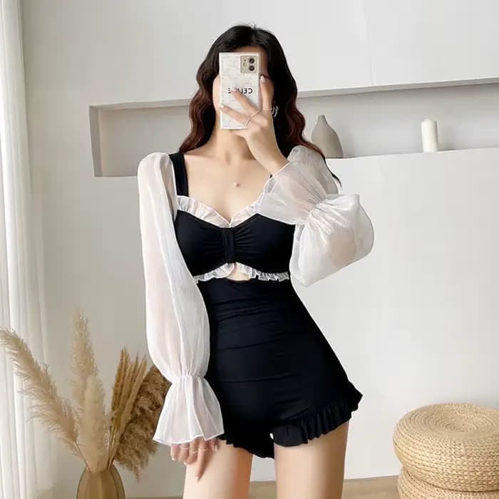 Maillot de bain une pièce élégant noir transparent à manches longues avec découpe avant et volants