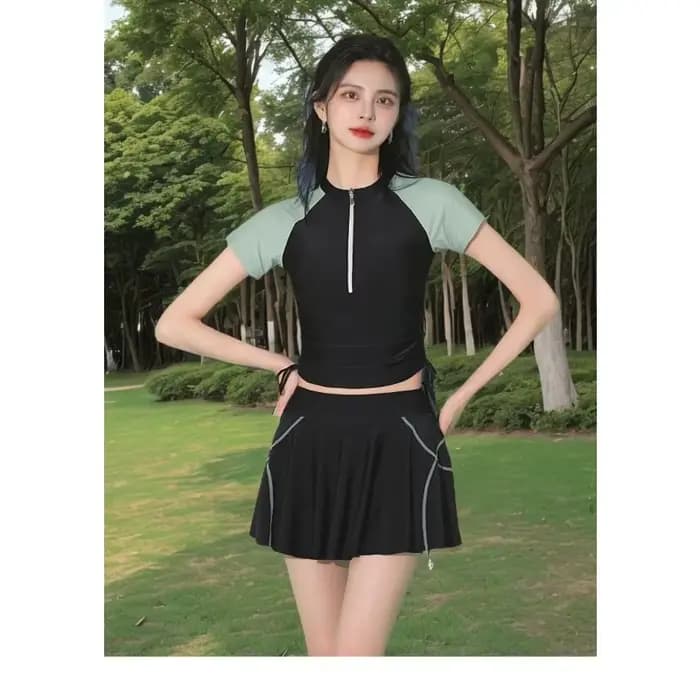 Ensemble de maillot de bain athlétique deux pièces avec haut à manches courtes à demi-zip et jupe froncée à nouer sur